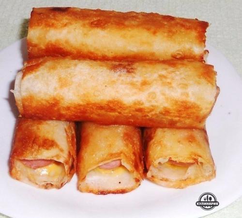 Сосиски в картофель - сырной шубке.

